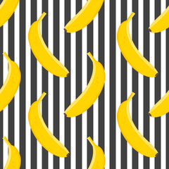 Canvas Print - Yellow bananas on a striped black and white background form a seamless tropical pattern for modern textiles and wrapping paper. 