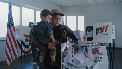 African American man and Caucasian man with child put ballots in box. Multiethnic American voters, people fill out bulletins in voting booths at polling station. Election Day in the USA. Democracy.