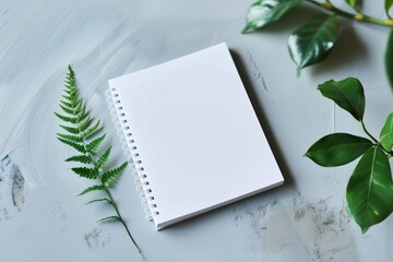 Poster - On a light grey background, a blank photorealistic notebook mockup is presented.