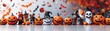 © AshrofS - Halloween decorations with pumpkins, ghosts, witches, and autumn leaves create a festive and spooky atmosphere for the celebration.