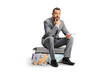 © Ljupco Smokovski - Worried bussinessman sitting on a suitcase and waiting for a flight
