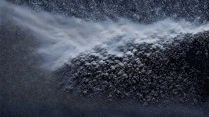 Frozen water on a dark background. Abstract backgroun