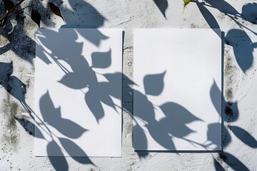 Sticker - White textured paper vertically laid on a gray tabletop. Overlay mockup overlaying the shadows of an exotic plant.