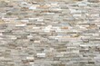 © luca piccini basile - External wall covering made of  brick stones of different colors. Full frame. Background and texture.