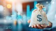 © patcharida - Hand grasping sack of money with dividend growth charts, longterm investment, financial planning