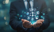 © sornram - Businessman with holographic law icons and balance scale, representing legal services and technology innovation in the legal field.