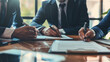 © VK Studio - Three business professionals engaged in signing documents in a meeting room, reflecting commitment and professionalism.