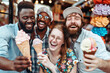 © Victor Mulero - A group of people are smiling and holding ice cream cones