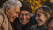 © VK Studio - Three generations of women embrace each other in a hug, sharing a tender, joyful moment in a picturesque, autumn setting.