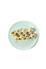 Canvas Print - Salmon Tartare Sushi Roll with Cucumber on Mint Green Plate - Minimalist Food Photography