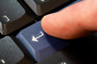 © Tomasz - Man's finger pressing a blue enter key on a desktop PC computer keyboard object macro, extreme closeup, one person. Confirming an action, sending a chat message accepting rules simple abstract concept