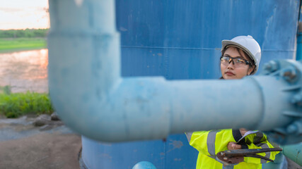 Environmental engineers work at wastewater treatment plants,Female plumber technician working at water supply