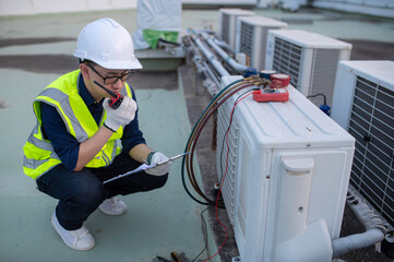 Wall Mural - Refrigeration and Air Conditioning Engineering Detects Plant Cooling Problems,electrician maintenance Condensing on the rooftop outdoors of large industrial building