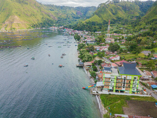 Aerial drone view of small town by  Toba Lake side at Haranggaol in Simalungun, Sumatra Utara, Indonesia