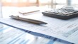 © ImageKing - Financial Documents on a desk top view. Pen and Calculator near documents.
