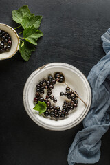 Wall Mural - black currant on a light plate