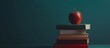 © carballo - books stacked with apple, back to school