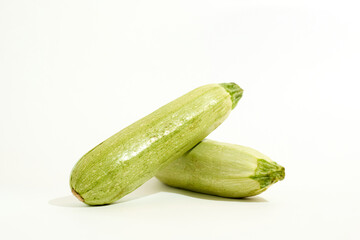 Two Cucumbers on White Surface