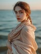 © PROKOPYCH - The image of a beautiful young woman in a summer shawl against the background of the sea. AI generative.