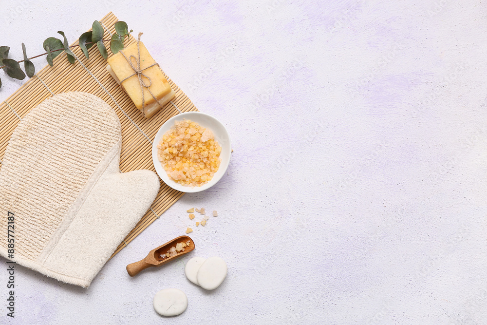 Composition with massage mitten, eucalyptus twig and sea salt on white background