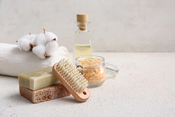 Wall Mural - Soap bars, sea salt in glass jar, massage body brush and towel on white background