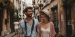 © Andres Mejia - Young tourist couple walking down picturesque street in europe