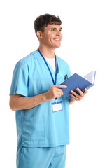 Poster - Male medical student with book and badge on white background