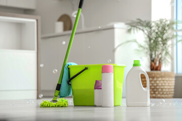 Wall Mural - Mop with bucket, different cleaning supplies and soap bubbles on floor at home