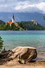 Wall Mural - Panoramic view from Lake Bled, beauty heritage in Slovenia. Island with church and castle in the background create a dream setting. View from Ojstrica and Mala Osojnica with the heart-shaped bench.