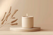 © Imane - minimalist beige candle on round stone pedestal with soft shadow and fluffy sprig decoration