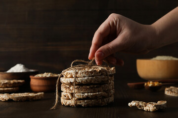 Wall Mural - Crisps bread with milk and ingredients, on a dark background.