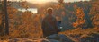 © tongpatong - A Scandinavian individual outside on a nice day using a laptop
