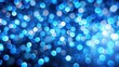 © Nasnunt - Abstract blurred blue lights creating a bokeh background, blue, bokeh, abstract, lights, background, blurred, shiny, dark, texture