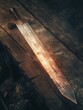 © Ariestia - Mystical sword with glowing runes lies on a wooden table