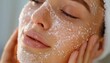 © Surasak-Art - Close-up of woman exfoliating her face, spa healthy skin, gentle skin exfoliation