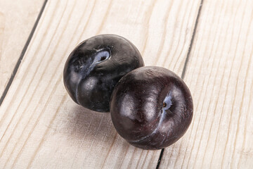 Two ripe sweet black plums