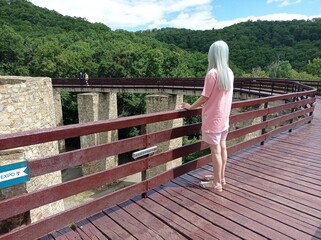 Woman on Scenic Walkway by Historic Site