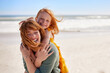 © Rido - Joyful young mother smiling with little daughter at beach