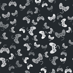 Poster - grey gamepad icon isolated seamless pattern on black background. game controller. vector