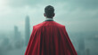 © varut - Visionary leader in business attire and a red super hero