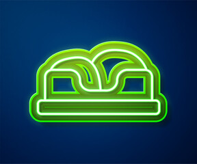 Sticker - Glowing neon line Pet bed icon isolated on blue background. Vector