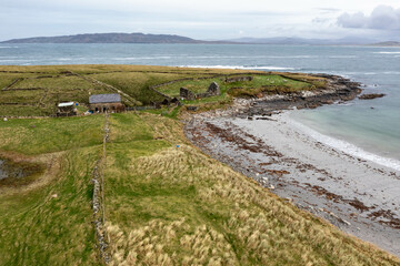 Wall Mural - Aerial view of the Inishkeel island during a misty and hazy winter day - Portnoo, County Donegal, Ireland