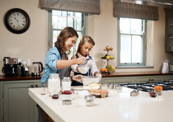 Wall Mural - Baking, mama and girl in kitchen, ingredients and recipe with utensils, hobby and time together. Family, single parent and teaching with mother, daughter and happiness with cooking, home or learning