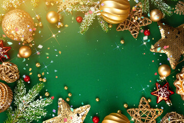 Poster - Beautiful golden Christmas decorations stars and balls on green background. Christmas greeting card template, Happy New Year banner layout.