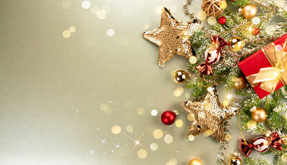 Poster - Christmas decorations concept. Gold stars, gift and balls and fir branches on a golden background. Greeting card mockup, New Year banner template.