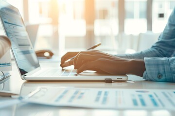 Poster - An advisor using a laptop to explain investment strategies to a client, highlighting planning and expertise, with generous copyspace.