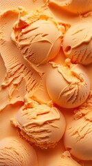 Orange mango ice cream scoop on a textured surface, perfect for summer indulgence.