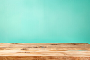 Poster - Empty light brown wood table top on pastel green background for product display montage, space photography