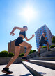 © Lustre Art Group  - Fit, young couple, man and woman, exercises by running up outdoor stairs in urban setting on bright, sunny day. Concept of sport and healthy lifestyle, pair training, leisure activity.