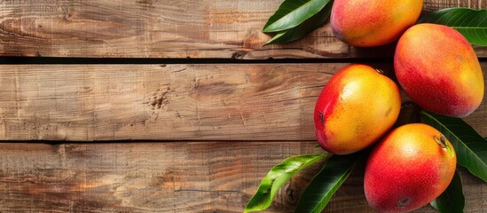 Poster - Delicious mango on wooden backdrop with copy space image